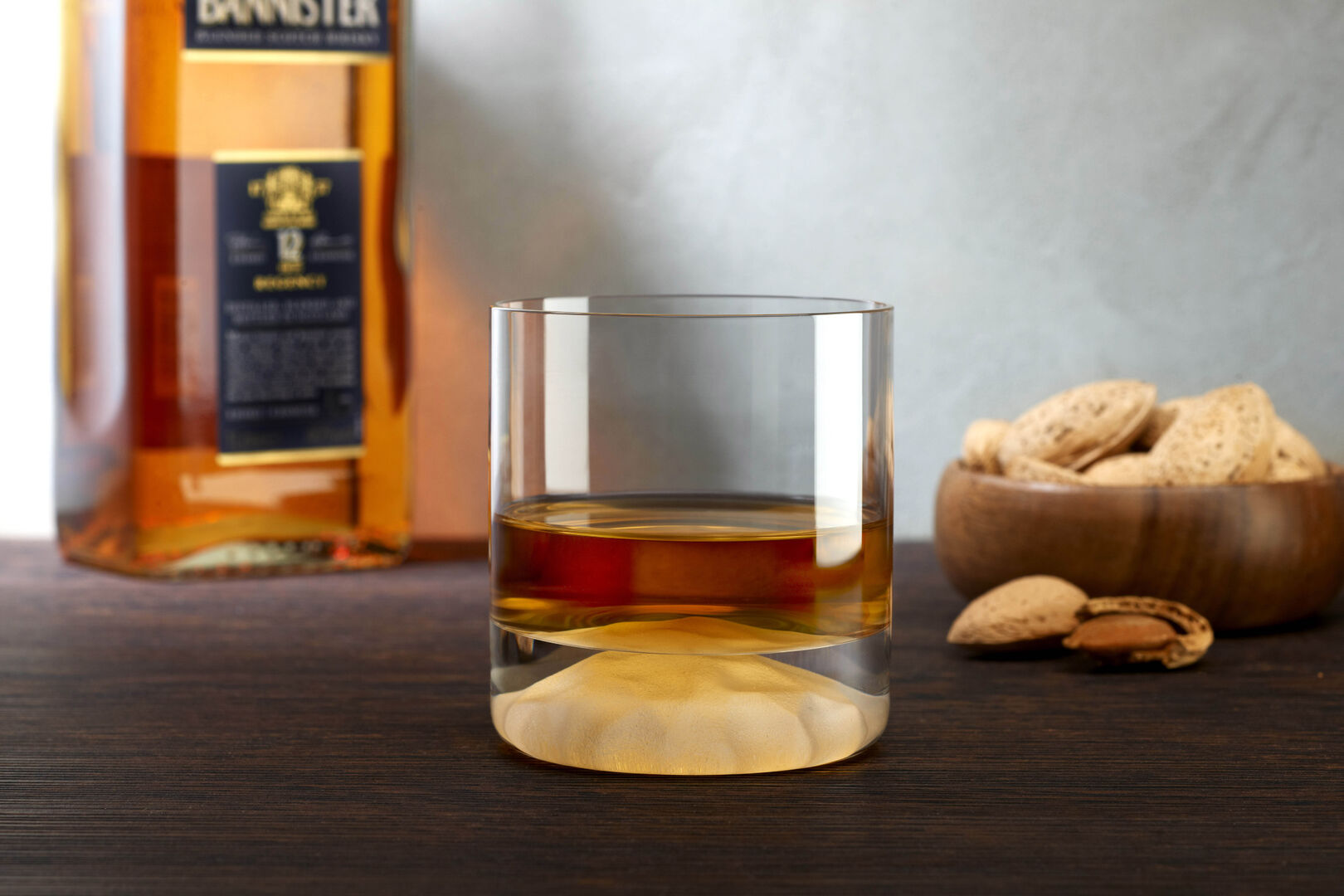 Cube ICE Whisky Tumbler with Whisky bottle in the background