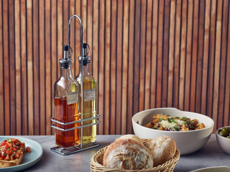 Cruet set featuring oil and vinegar bottles with chrome stand