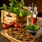 Oil and vinegar chrome stand with pizza and herbs