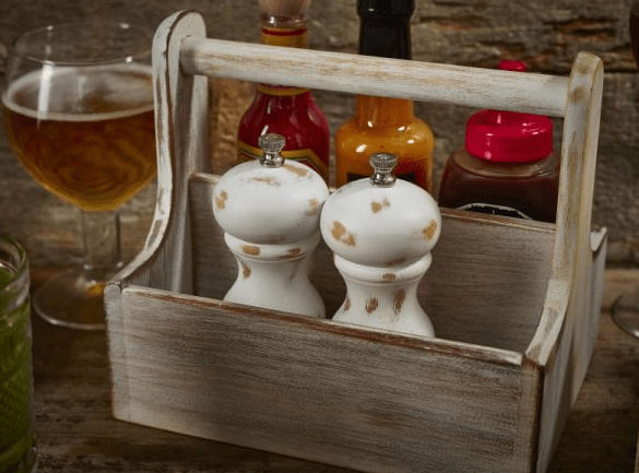 White Washed Wooden salt and Pepper Grinders in a table caddy