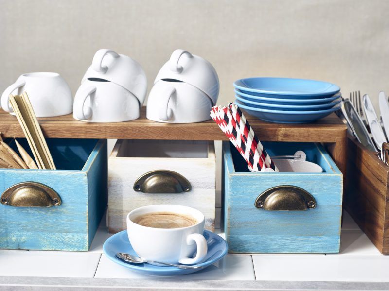 Blue and White Acacia Wood Display drawers in a buffet setting