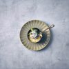 Vintage Steel Mino Saucepan on a plate