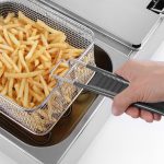 Close up of the Hendi Twin Tank Electric Fryer frying chips