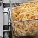 Cooked fries close up in the basket of the Hendi Twin Tank Electric Fryer 2 x 6 Litre