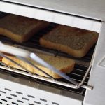 Close up of toast inside the Hendi Conveyor Toaster