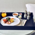 Black Butler Tray with English breakfast, orange juice and salt and pepper pots.
