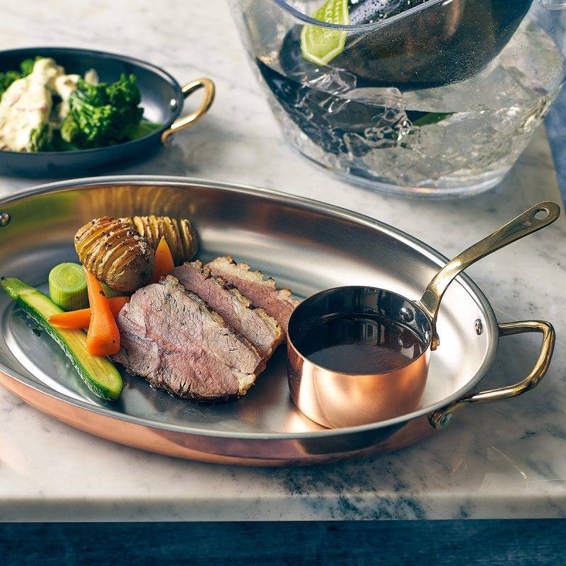 Oval Copper Serving Tray with meat dinner also known as a Copper Plated Serving Dish