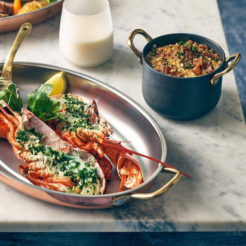 Oval Copper Serving Tray Lifestyle Image with Seafood also known as a Copper Plated Serving Dish
