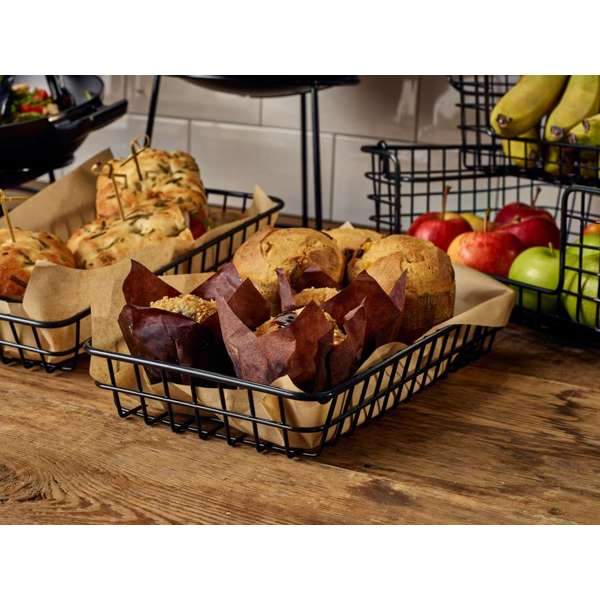 Black wire display basket with muffins on a buffet set up