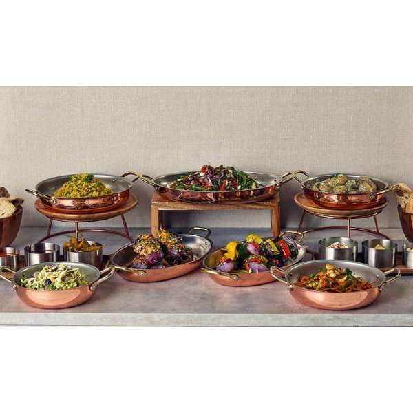 Buffet presentation featuring round copper dishes