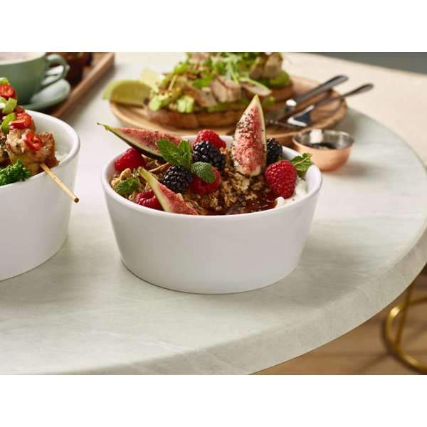 Lifestyle image of food presentation using a White Porcelain Conical Salad Bowl