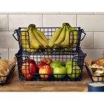 stacked black wire displsay baskets with bananas and apples