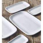 Range of white porcelain rounded rectangular plates