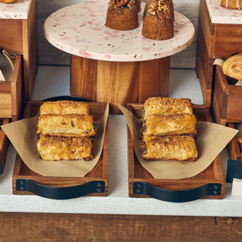 2 Acacia Wood Serving Trays with sausage rolls on a buffet presentation