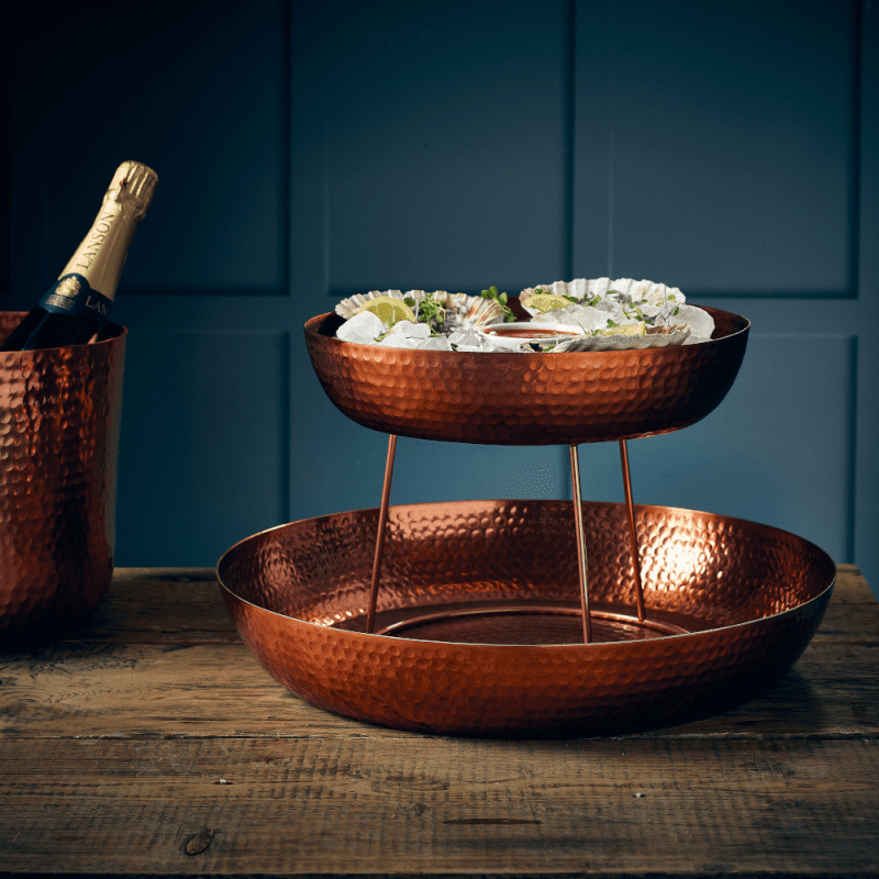 2 sizes of copper hammered platters with seafood presentation