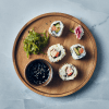 Sushi served on an Acacia Wood Presentation Plate