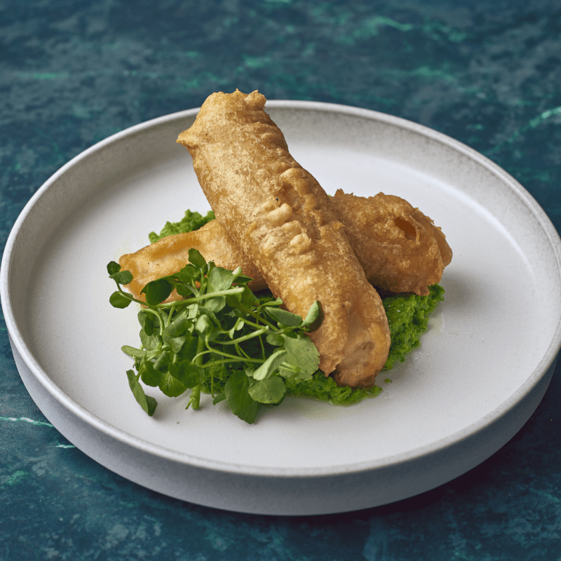 Battered fish served on a 24-5cm Sereno Cirrus Presentation Plate