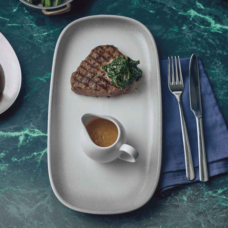 Steak and sauce served on a 35cm Sereno Cirrus Rectangular Platter