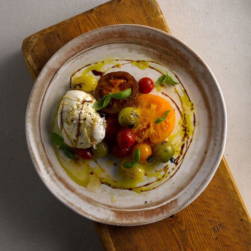 Mozarella salad served on a 29cm Fincs Sandstone Organic Coupe Plate