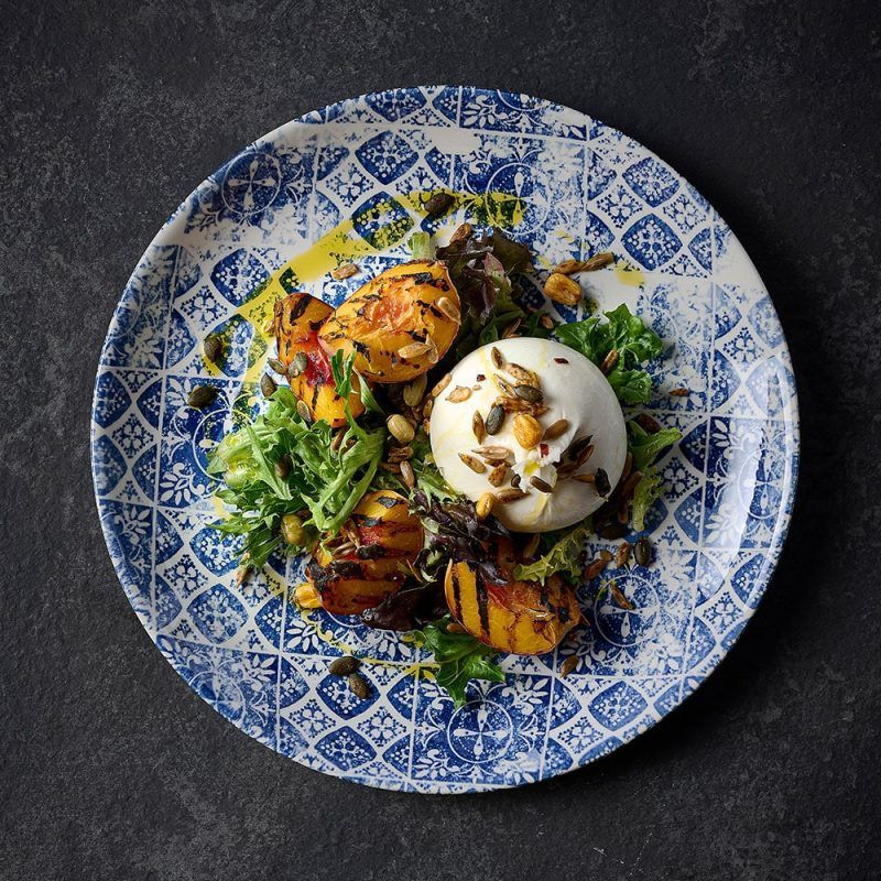 Peach salad served on a 26cm Porto Blue Coupe Plate