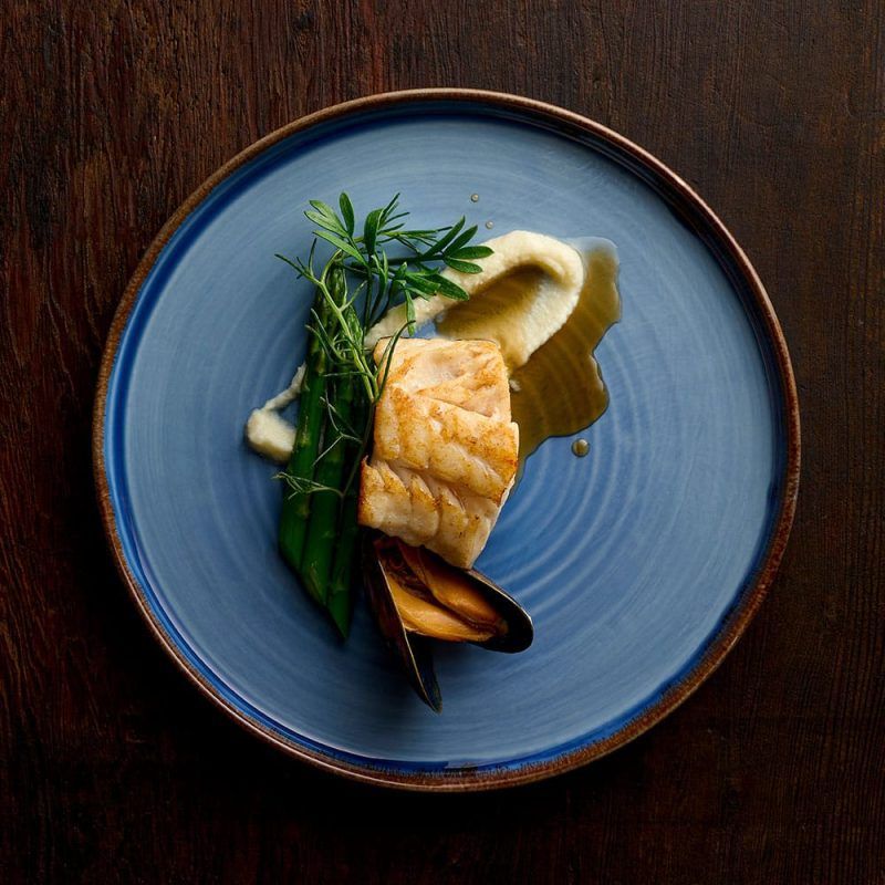 Seafood served on a Harvest Indigo Walled Plate