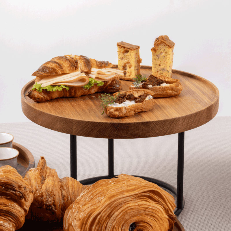 Oak Buffet Plinth on a riser displaying buffet food