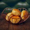 Bread rolls displayed in a Lotus Leaf Copper Wire Basket
