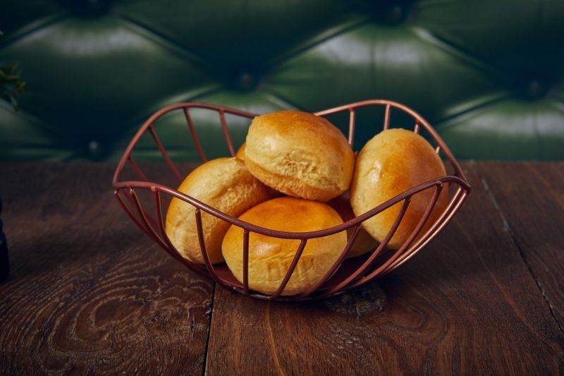 Bread rolls displayed in a Lotus Leaf Copper Wire Basket