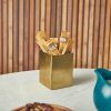 Lifestyle image featuring a Gold Plated Stainless Steel Sachet Holder