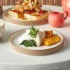 Lifestyle table setting including a 20cm Kava White Raw Wall Plate