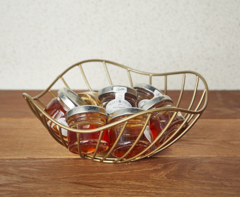 Preserves displayed in a Lotus Leaf Gold Wire Basket