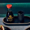 Soy Sauce and Jug displayed on an Oval Black Wood Veneer Tray