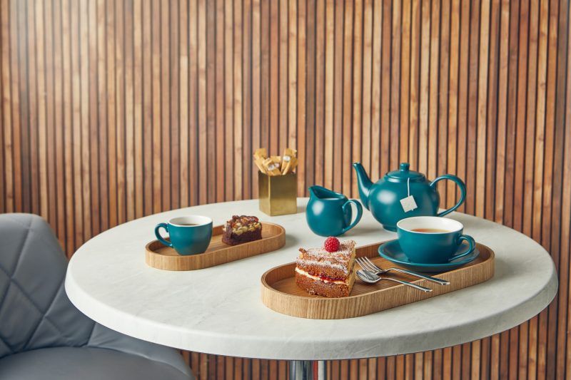 Tea and cake served on Oval Light Wood Veneer Trays