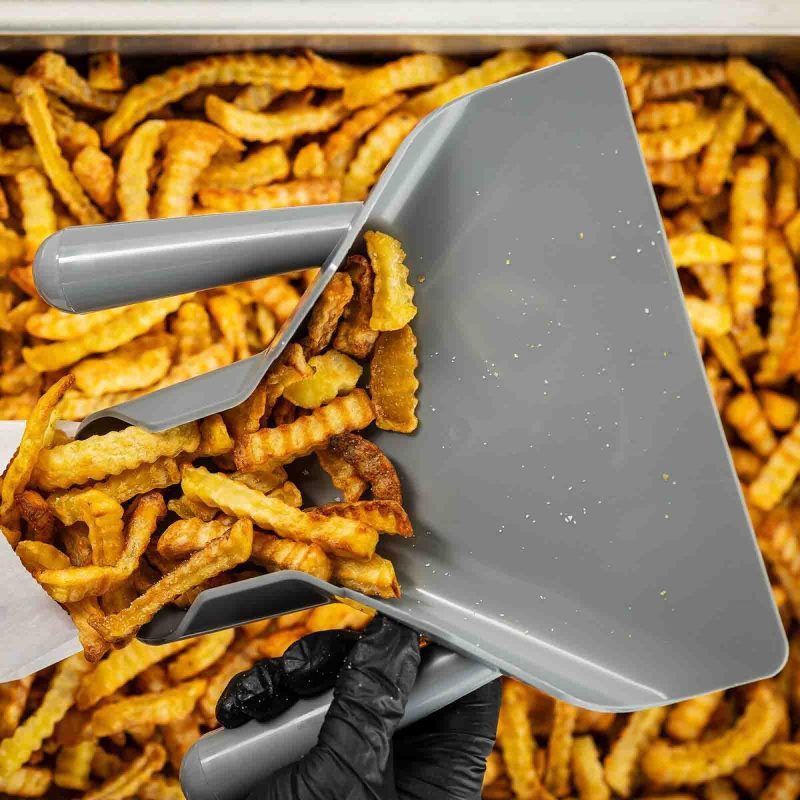 Dual Handle Plastic French Fry Scoop in use
